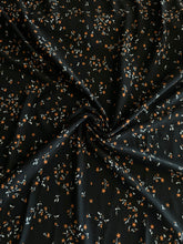 Load image into Gallery viewer, ITY Moss crepe: 4.25 YD CUT REMNANT Black tiny white orange flowers ⭐️
