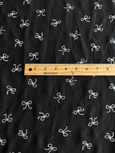 Load image into Gallery viewer, Embroidered CEY airflow woven: 2 YD CUT REMNANT Black white bows ⭐️
